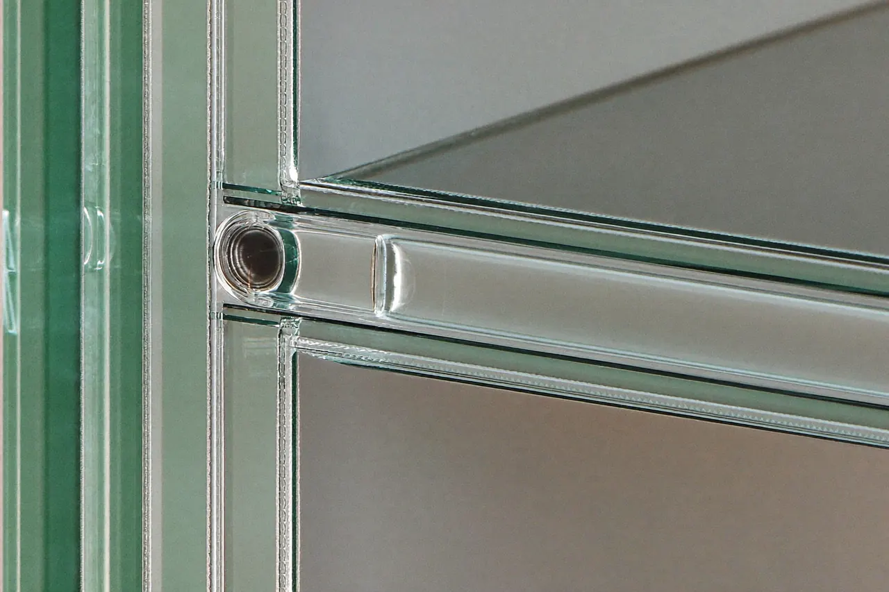 Close-up of a double glazing sealed unit showing the spacer bar and seal