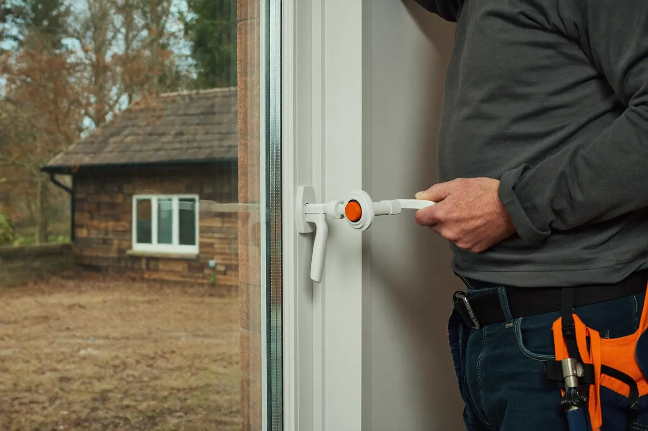 Installer demonstrating the sealed unit and hardware covered by a window guarantee