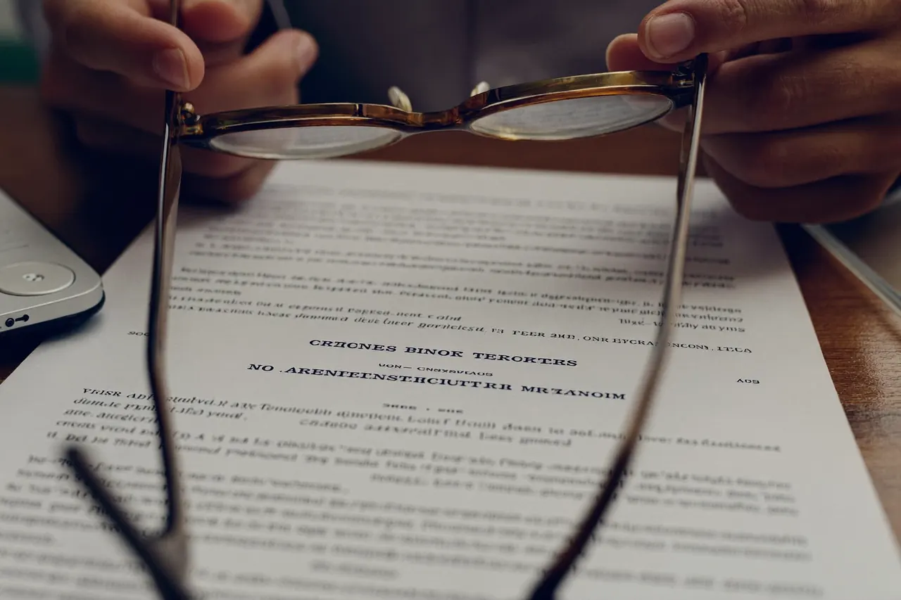 Close-up of a homeowner reading the terms and conditions on a window contract